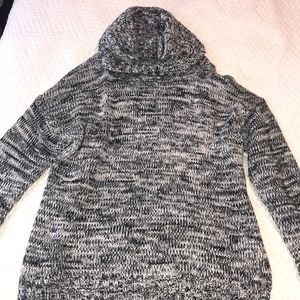 A woven sweater with slits on the side